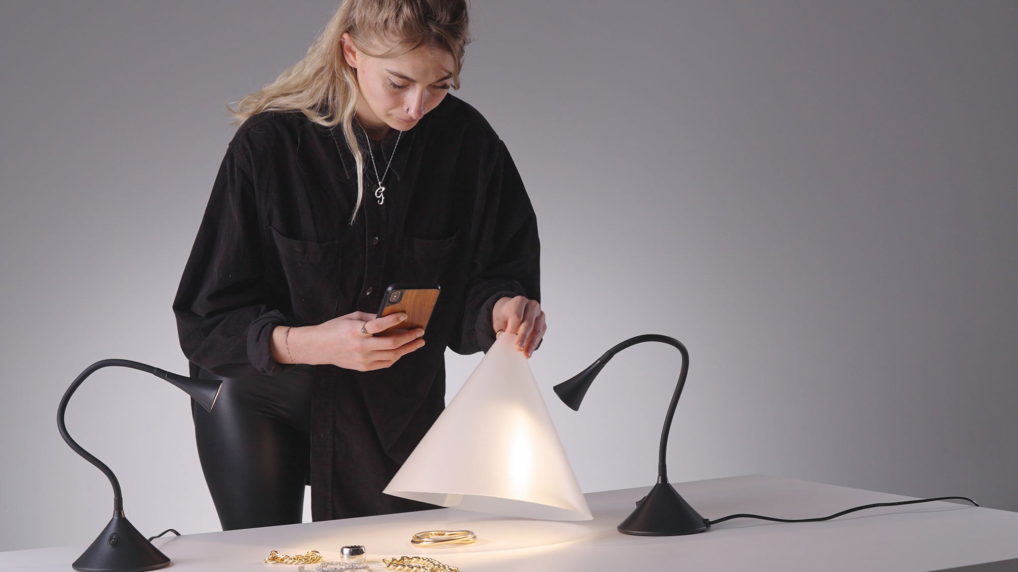 Photographer using the Karl Taylor Light Cone phone version to photograph jewelry.