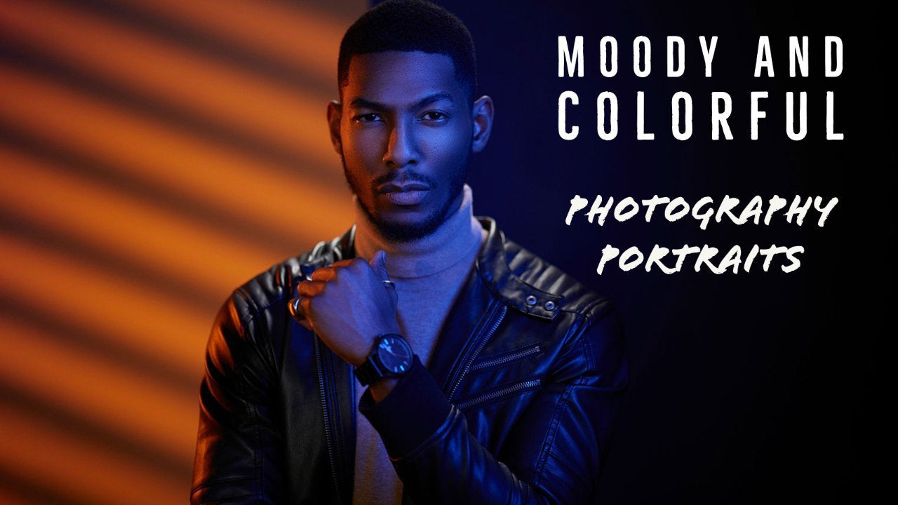 Dramatic and colorful portrait of black male model with orange and blue lighting.