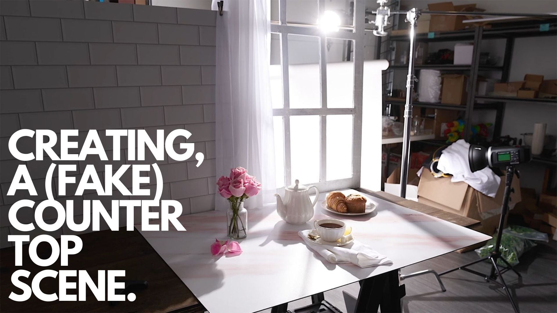 Photography studio setup of breakfast and tea with fake countertop.